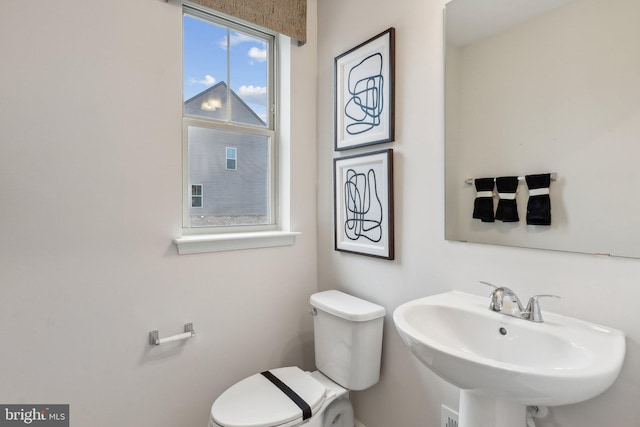 bathroom featuring a sink and toilet