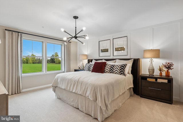 bedroom with an inviting chandelier, baseboards, and light carpet