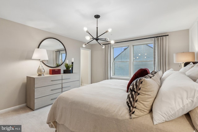 bedroom with baseboards, light colored carpet, and a chandelier