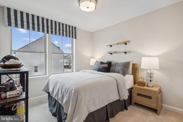 bedroom with carpet and baseboards