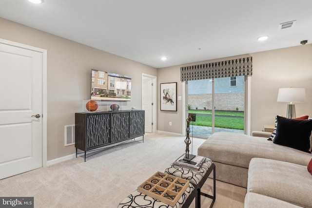 living room featuring recessed lighting, carpet flooring, baseboards, and visible vents