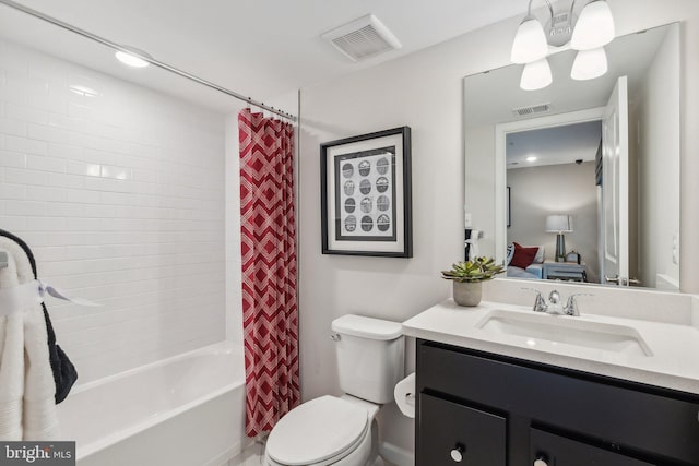 full bathroom with vanity, toilet, visible vents, and shower / tub combo with curtain