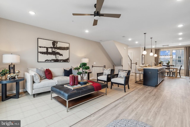 living area featuring recessed lighting, light wood-style flooring, and ceiling fan