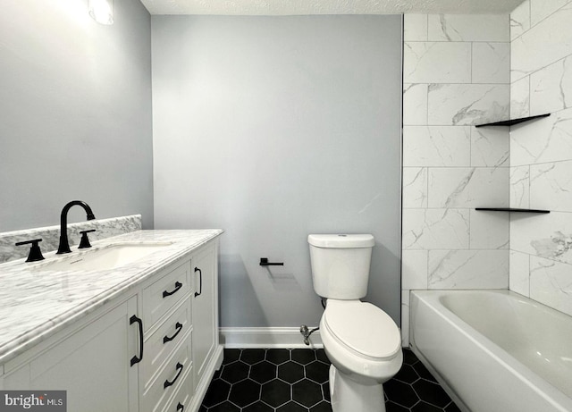 bathroom featuring tile patterned floors, toilet, a textured ceiling, baseboards, and vanity