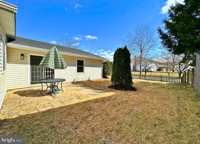 view of yard with a patio and fence