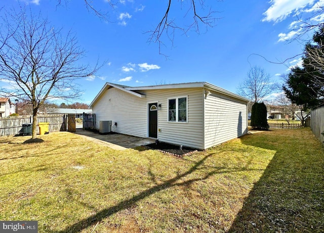 back of house with a patio, a yard, central AC unit, and fence private yard