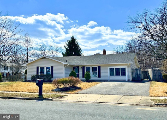 single story home with aphalt driveway, a chimney, roof with shingles, and fence