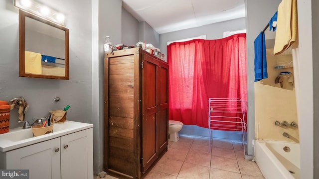 bathroom featuring tile patterned floors, toilet, vanity, and radiator heating unit