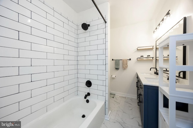 full bathroom featuring washtub / shower combination, baseboards, double vanity, a sink, and marble finish floor