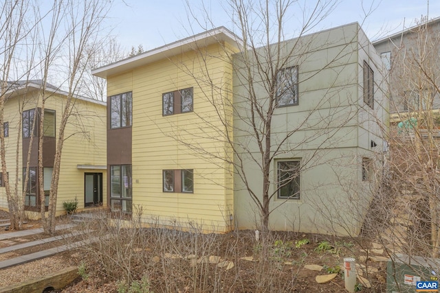 back of house with stucco siding