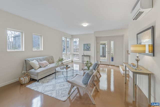 living room with a wealth of natural light, finished concrete flooring, and a wall mounted AC