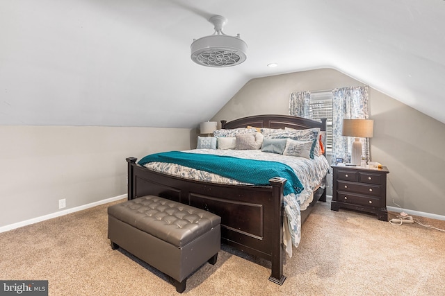 bedroom with baseboards, carpet floors, and vaulted ceiling