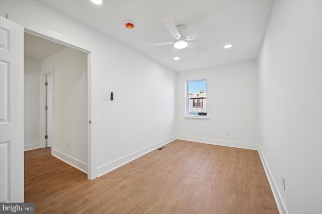 unfurnished room with recessed lighting, light wood-type flooring, baseboards, and ceiling fan