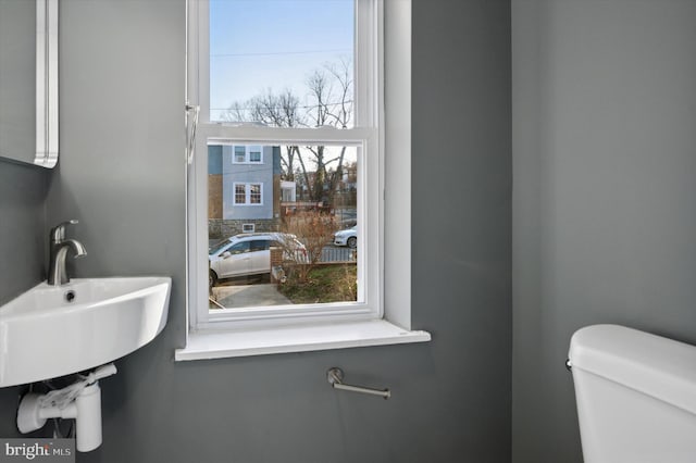 bathroom featuring toilet and a sink