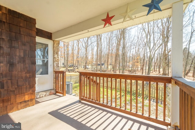 wooden deck with central air condition unit