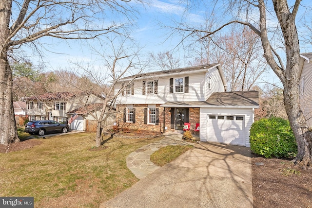 view of front of house featuring a front lawn, brick siding, a garage, and driveway