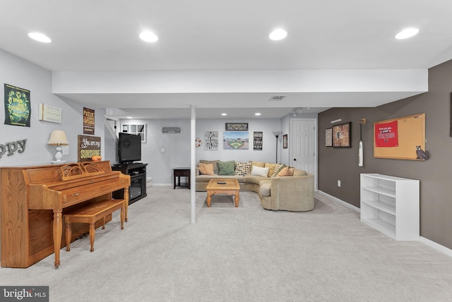 living room with recessed lighting, visible vents, and light colored carpet