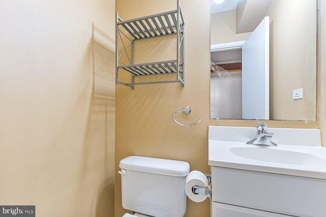 bathroom with toilet and vanity