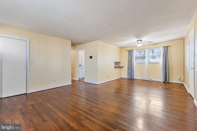 unfurnished living room featuring visible vents, baseboards, ceiling fan, hardwood / wood-style floors, and a textured ceiling