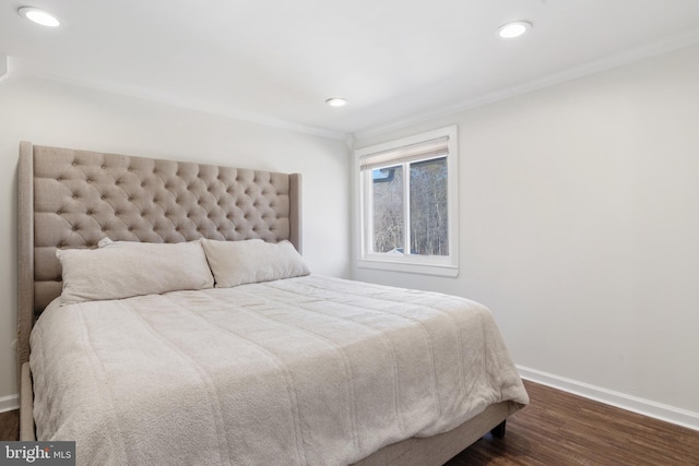 bedroom with recessed lighting, baseboards, dark wood-type flooring, and crown molding