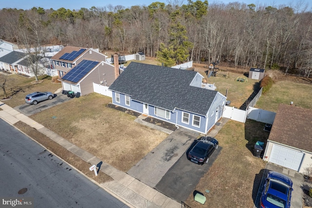 aerial view featuring a residential view and a view of trees