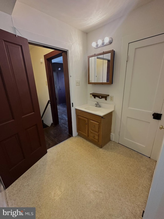 bathroom with tile patterned floors and vanity