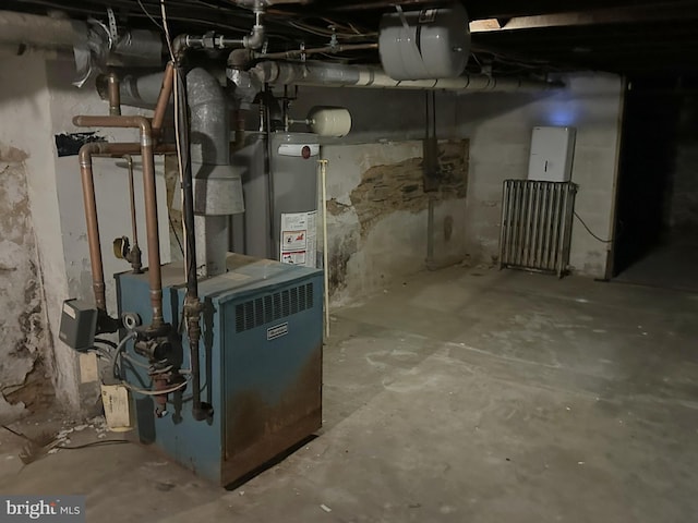 utility room with water heater