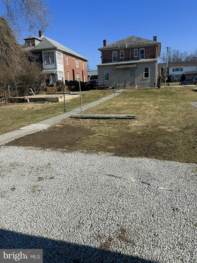 exterior space with a front lawn