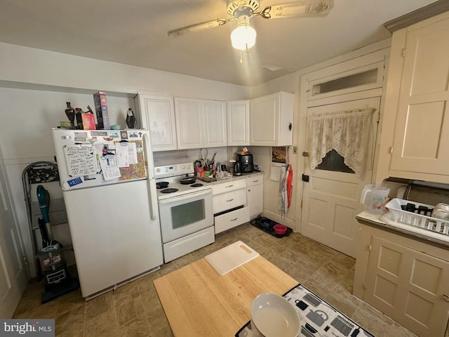 kitchen with a ceiling fan, white appliances, white cabinets, and light countertops