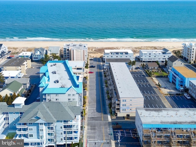 bird's eye view with a view of the beach and a water view