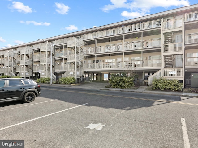 view of property featuring uncovered parking