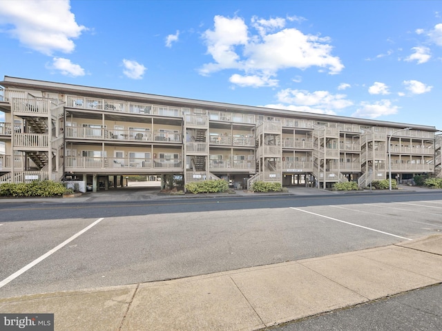 view of property with uncovered parking