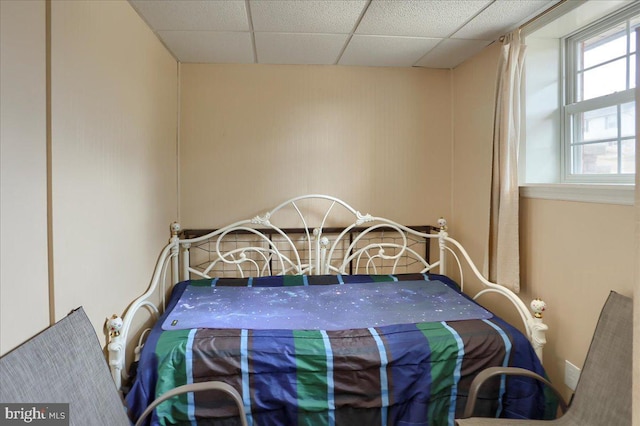 bedroom featuring a drop ceiling