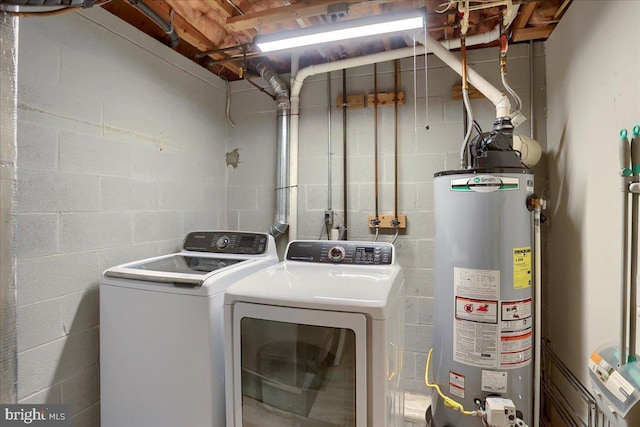 laundry area featuring washer and dryer, laundry area, and water heater