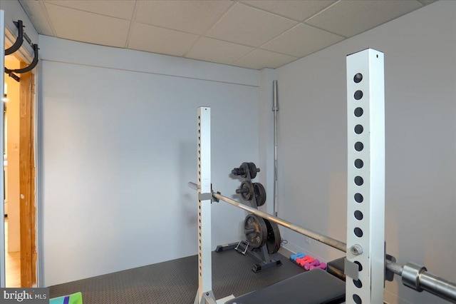 workout room featuring a drop ceiling