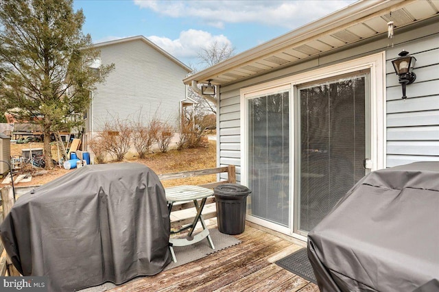 wooden deck with grilling area