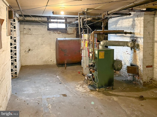 utility room with heating fuel and a heating unit