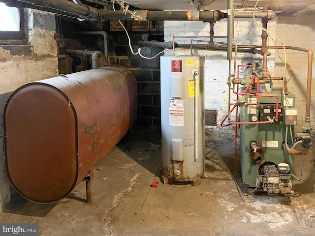 utilities featuring electric water heater, a heating unit, and heating fuel