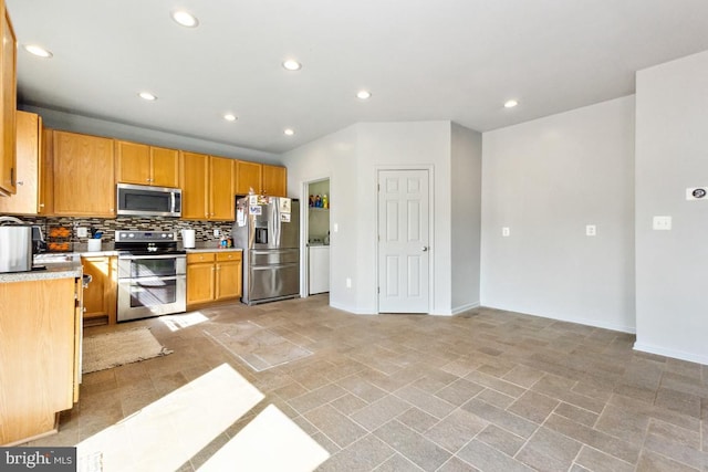 kitchen with recessed lighting, tasteful backsplash, appliances with stainless steel finishes, and light countertops