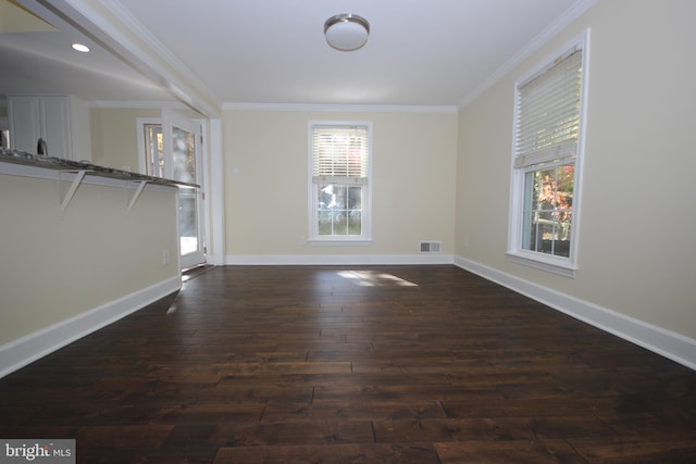 unfurnished room featuring visible vents, dark wood-style floors, recessed lighting, crown molding, and baseboards