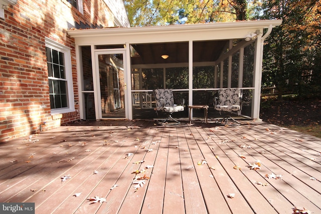 deck with a sunroom