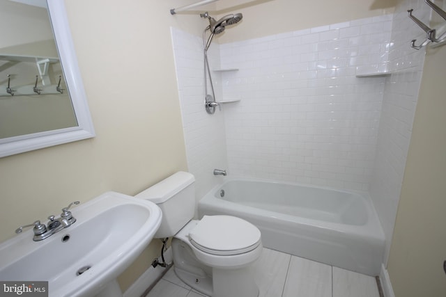 bathroom featuring  shower combination, toilet, and a sink