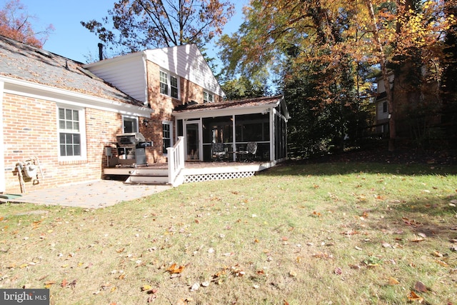 view of yard featuring a patio and a sunroom