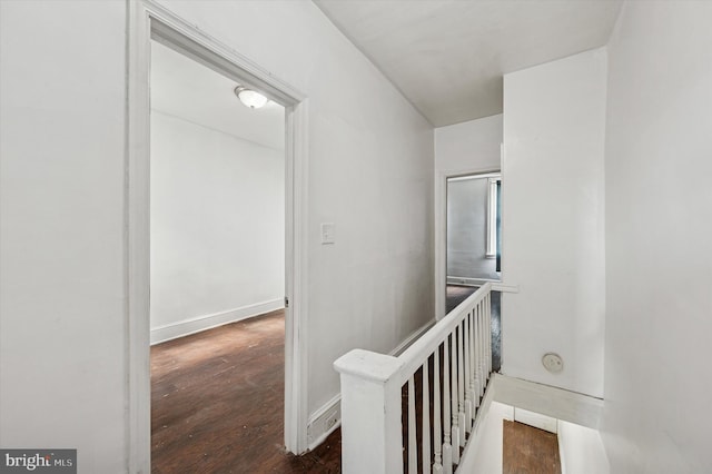 hall with wood finished floors