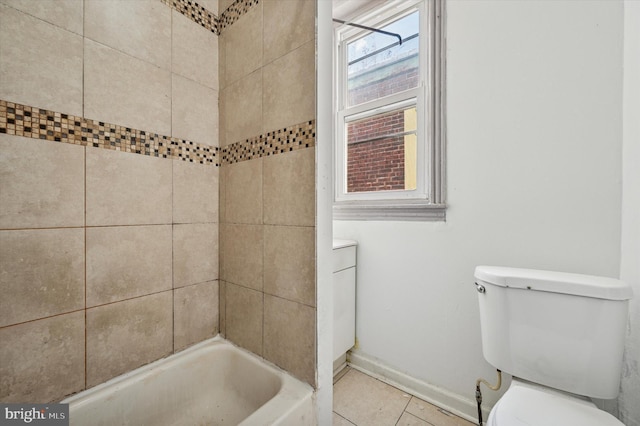 bathroom featuring tile patterned floors, toilet, and baseboards