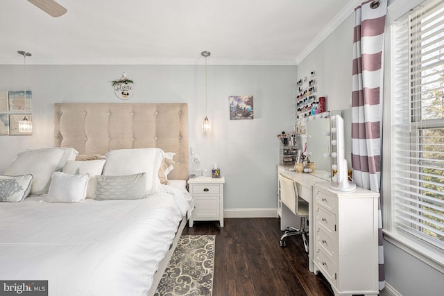 bedroom with crown molding, baseboards, dark wood-style flooring, and ceiling fan