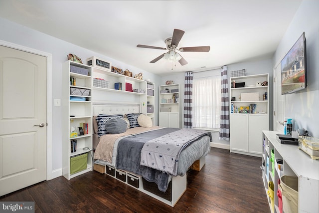 bedroom with baseboards, ceiling fan, and dark wood-style flooring