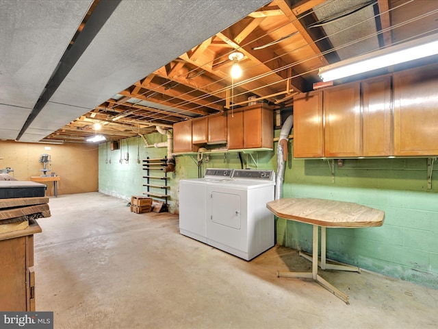 below grade area with washer and clothes dryer