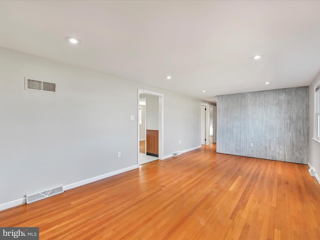 spare room featuring visible vents, recessed lighting, and light wood-style floors