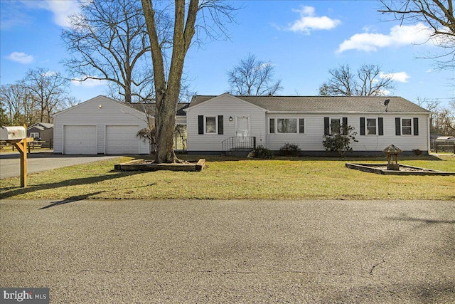 view of front of house featuring an outdoor structure and a front lawn